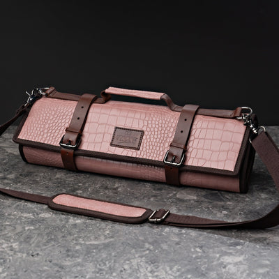 ITAMAE Sakura Rose Knifebag in full view, featuring premium rose croc-pattern leather, brown straps, and shoulder strap for chefs on the go.