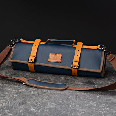 ITAMAE Sapporo Knifebag in navy blue leather with tan straps, shoulder strap, and embossed ITAMAE patch.